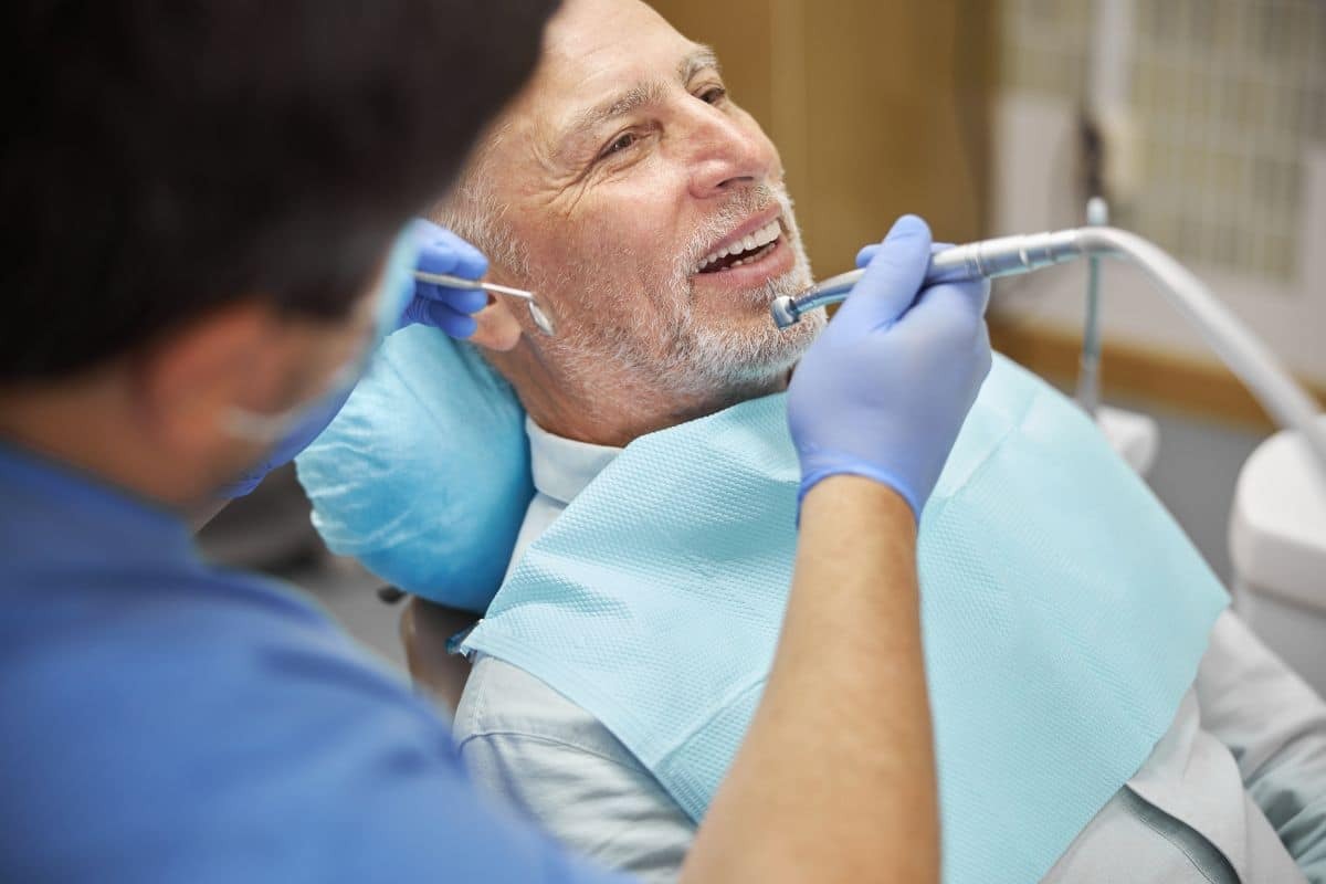 Smiling adult visiting an orthodontist for teeth alignment.